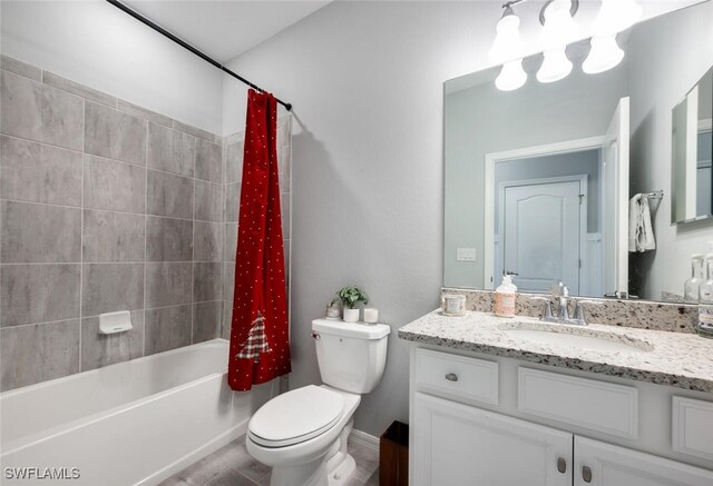 full bathroom with vanity, toilet, and shower / tub combo with curtain