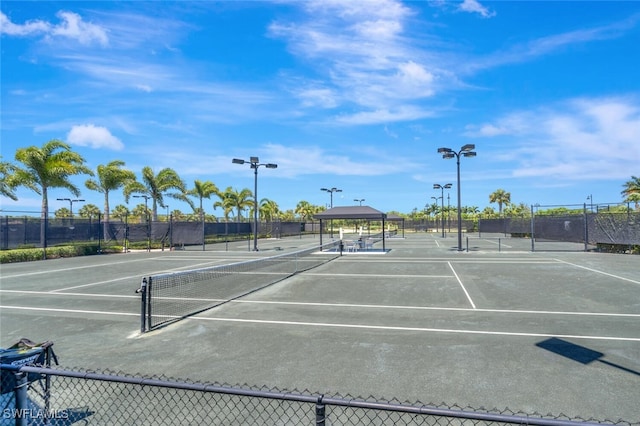 view of sport court featuring a gazebo and fence