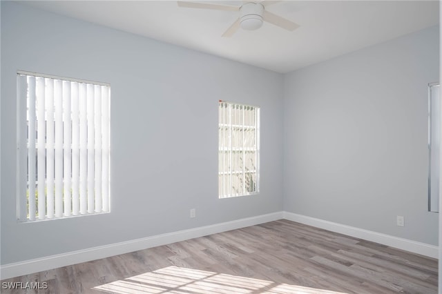 unfurnished room with ceiling fan and light hardwood / wood-style floors