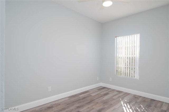 empty room with light hardwood / wood-style flooring and ceiling fan