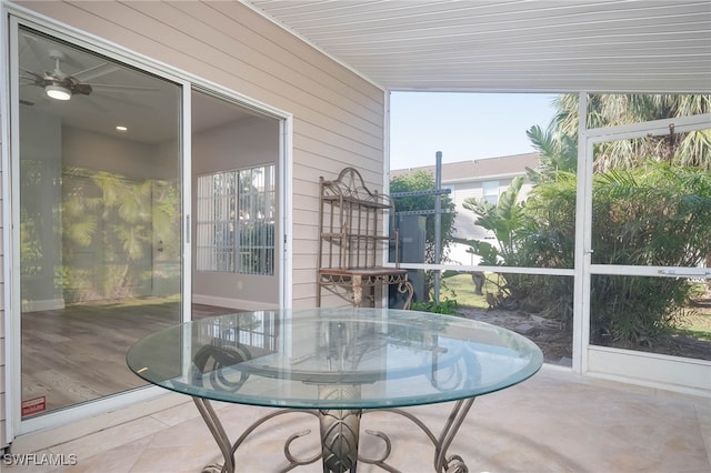 sunroom / solarium with ceiling fan