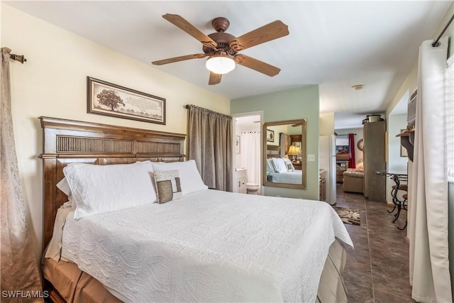 bedroom featuring a closet, ceiling fan, and dark tile patterned floors