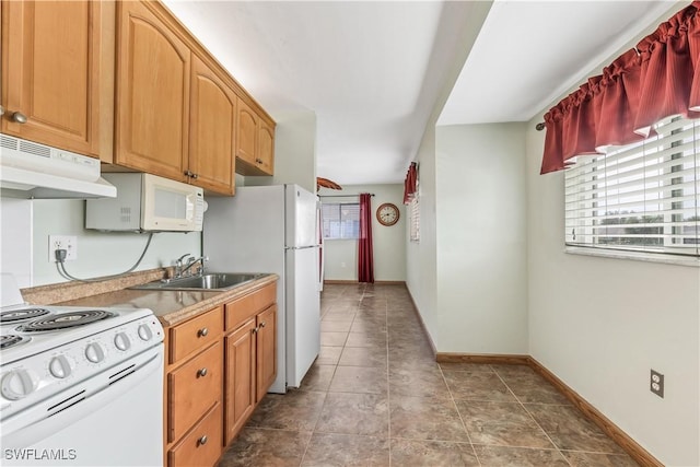 kitchen with sink and white appliances