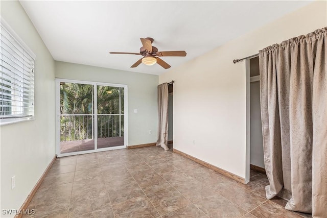 empty room featuring ceiling fan