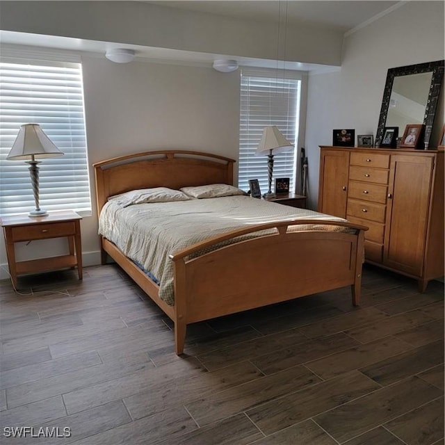 bedroom featuring hardwood / wood-style flooring and ornamental molding