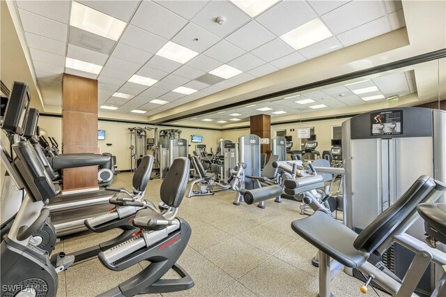 gym featuring a paneled ceiling