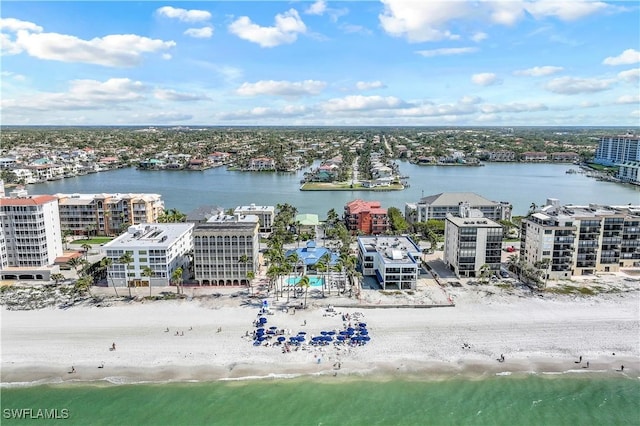 aerial view with a water view and a view of the beach