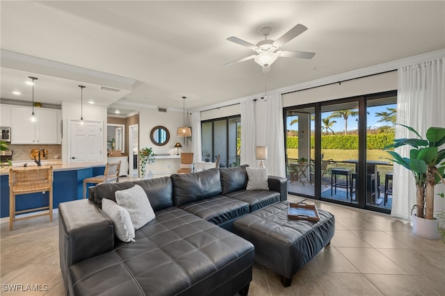 living room with light tile patterned floors, french doors, ceiling fan, and crown molding