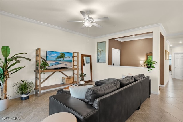 tiled living room with ceiling fan and ornamental molding