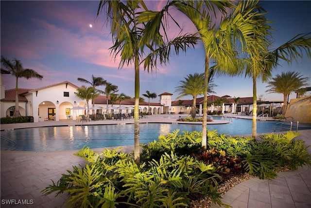 view of pool at dusk