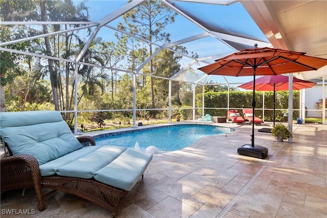 pool with a patio area and glass enclosure