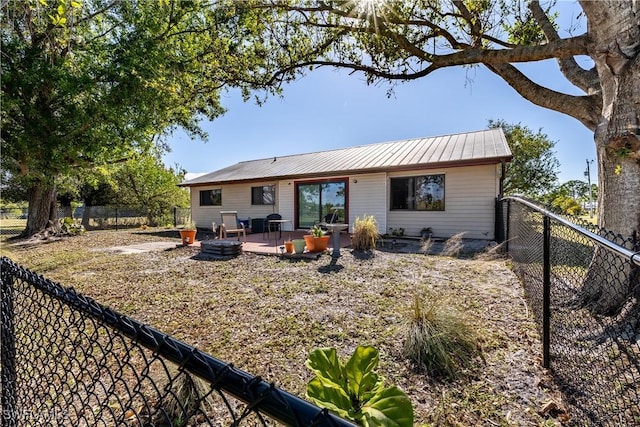 back of house with a patio