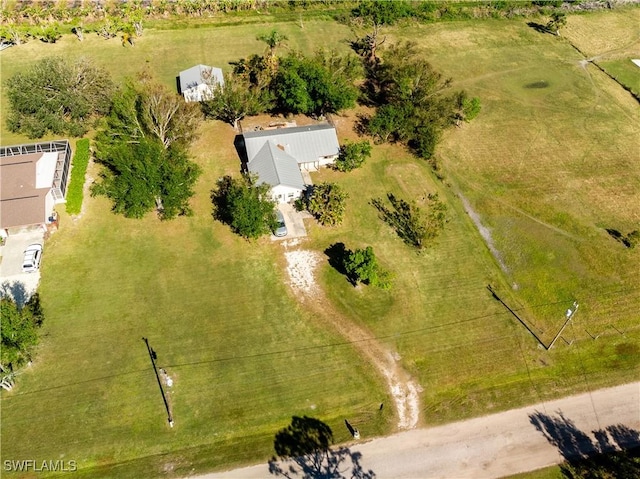 birds eye view of property featuring a rural view