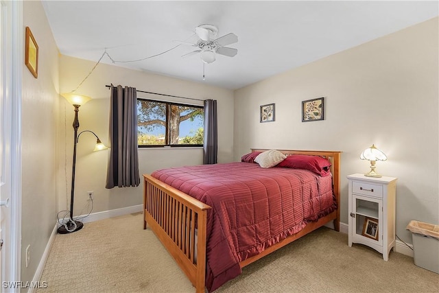 bedroom with light colored carpet and ceiling fan