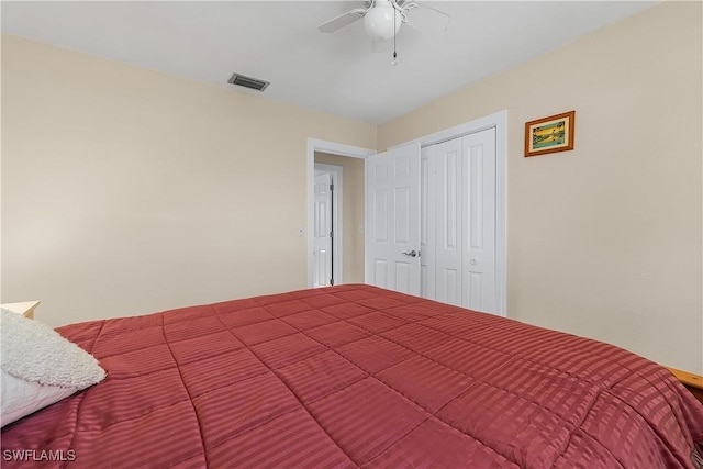 bedroom featuring ceiling fan and a closet