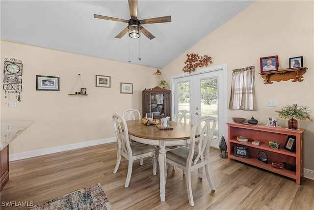 dining space featuring french doors, high vaulted ceiling, light hardwood / wood-style flooring, and ceiling fan