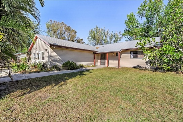 ranch-style home featuring a front yard