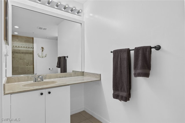 bathroom with vanity and tile patterned floors