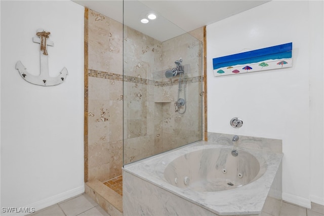 bathroom featuring tile patterned floors and independent shower and bath