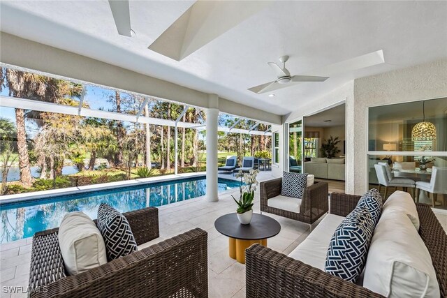 view of swimming pool featuring ceiling fan