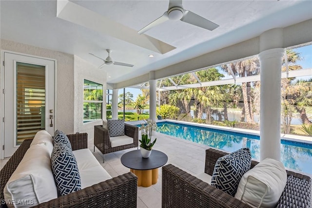 view of patio with an outdoor living space and ceiling fan