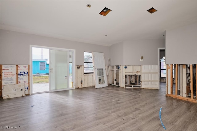 unfurnished living room with wood-type flooring