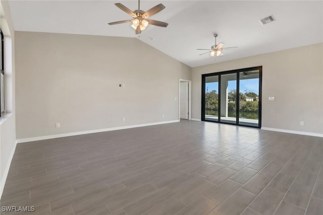 spare room featuring ceiling fan, dark hardwood / wood-style flooring, and vaulted ceiling