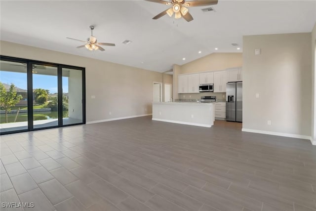 unfurnished living room with light hardwood / wood-style flooring, vaulted ceiling, and ceiling fan