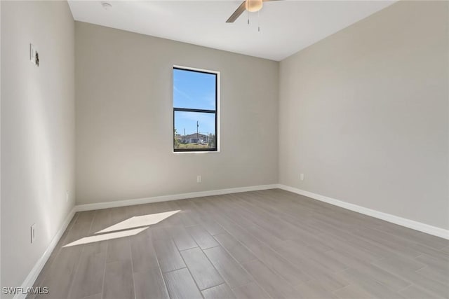 unfurnished room with light hardwood / wood-style flooring and ceiling fan