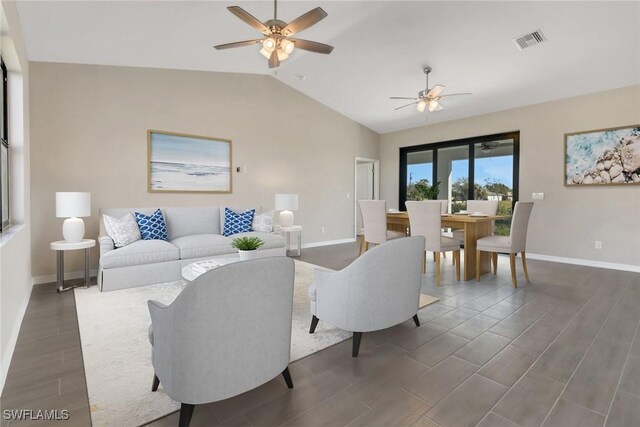 living room featuring vaulted ceiling, ceiling fan, and dark wood-type flooring