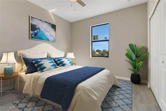 bedroom with ceiling fan and a closet