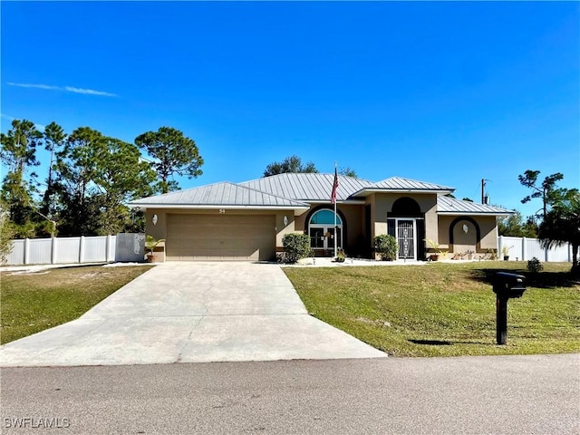 ranch-style house featuring a front yard and a garage