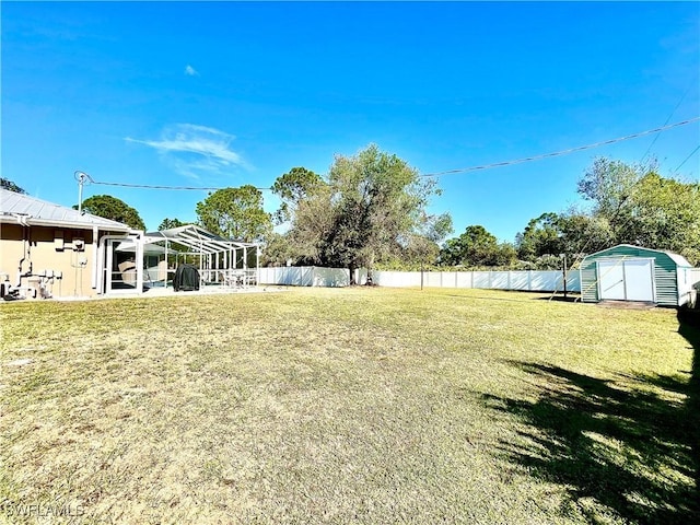 view of yard featuring a patio area and a shed