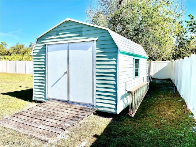 view of outbuilding featuring a yard