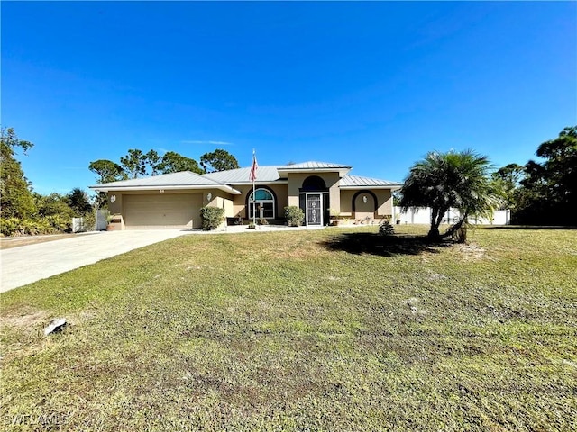 view of front of home featuring a garage and a front yard