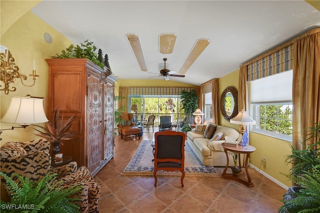 10801 Crooked River Rd Unit 203, Estero, FL 34135 - sitting room featuring a ceiling fan, lofted ceiling, tile patterned flooring, and baseboards