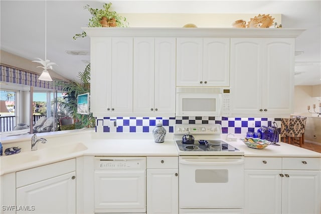10801 Crooked River Rd Unit 203, Estero, FL 34135 - kitchen with white appliances, light countertops, a sink, and white cabinets