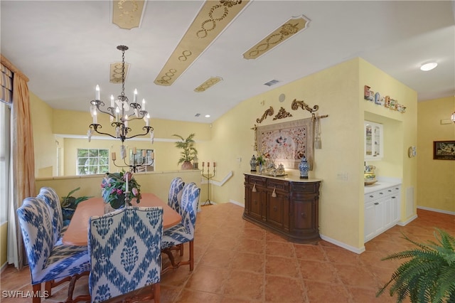 10801 Crooked River Rd Unit 203, Estero, FL 34135 - dining space with baseboards, visible vents, a chandelier, and tile patterned floors
