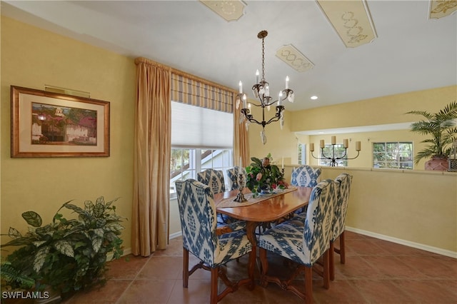 10801 Crooked River Rd Unit 203, Estero, FL 34135 - dining area with baseboards, tile patterned flooring, and a notable chandelier