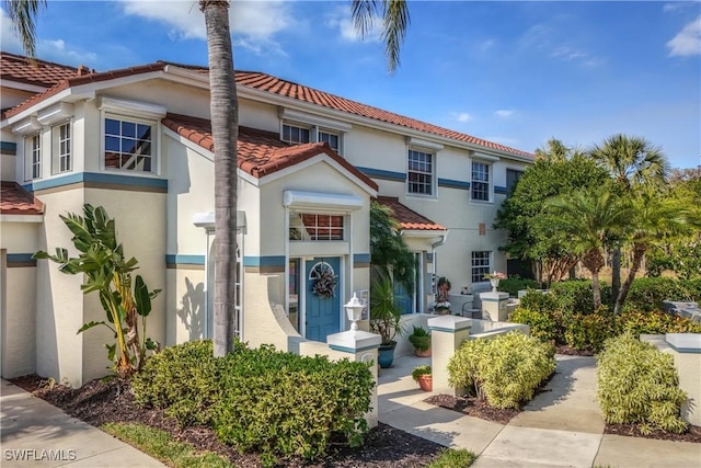 10801 Crooked River Rd Unit 203, Estero, FL 34135 - mediterranean / spanish house featuring stucco siding and a tiled roof