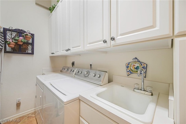 10801 Crooked River Rd Unit 203, Estero, FL 34135 - clothes washing area with washer and dryer, cabinet space, and a sink