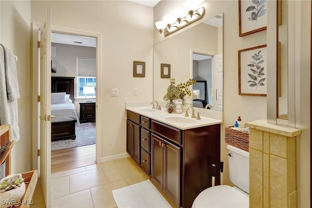 bathroom featuring vanity, toilet, and wood-type flooring