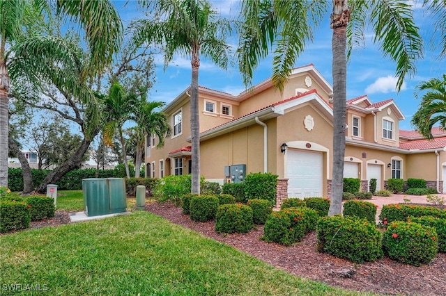 view of front of property with a garage