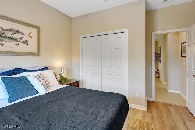 bedroom featuring hardwood / wood-style floors and a closet