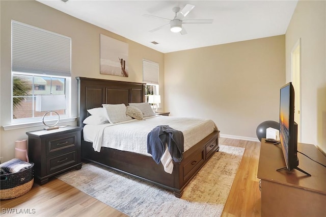 bedroom featuring ceiling fan and light hardwood / wood-style floors