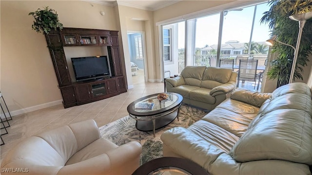 living room featuring ornamental molding and light tile patterned flooring