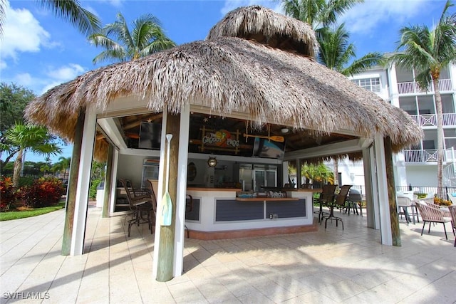 view of patio featuring a bar