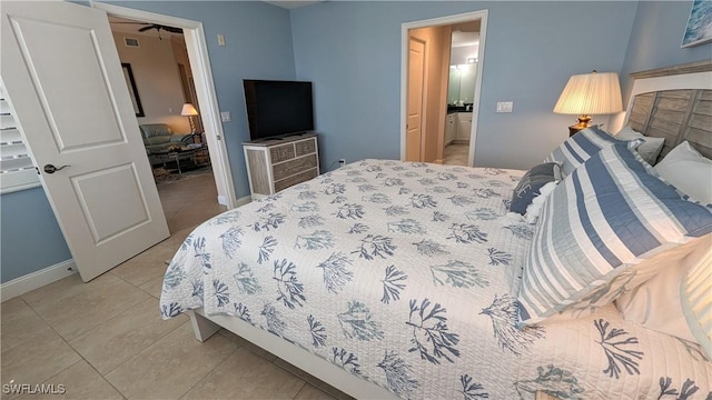 tiled bedroom with connected bathroom