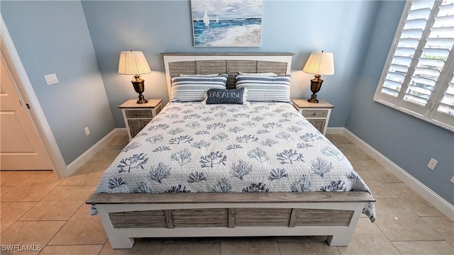 bedroom featuring light tile patterned flooring