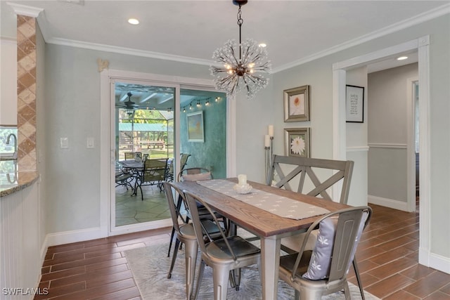 dining area featuring a notable chandelier and ornamental molding